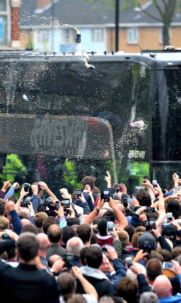 West Ham fans throw bottles, break windows as Man United bus arrives